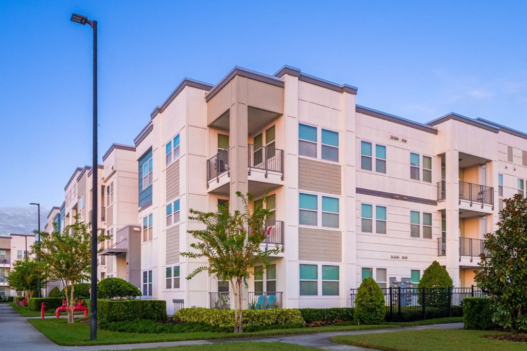 a building with a sidewalk in front of it at Linden on the GreeneWay, Florida