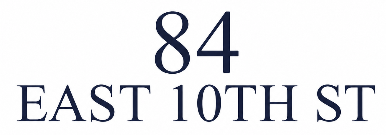 A sign with the number 84 and East 10th St written below it.
