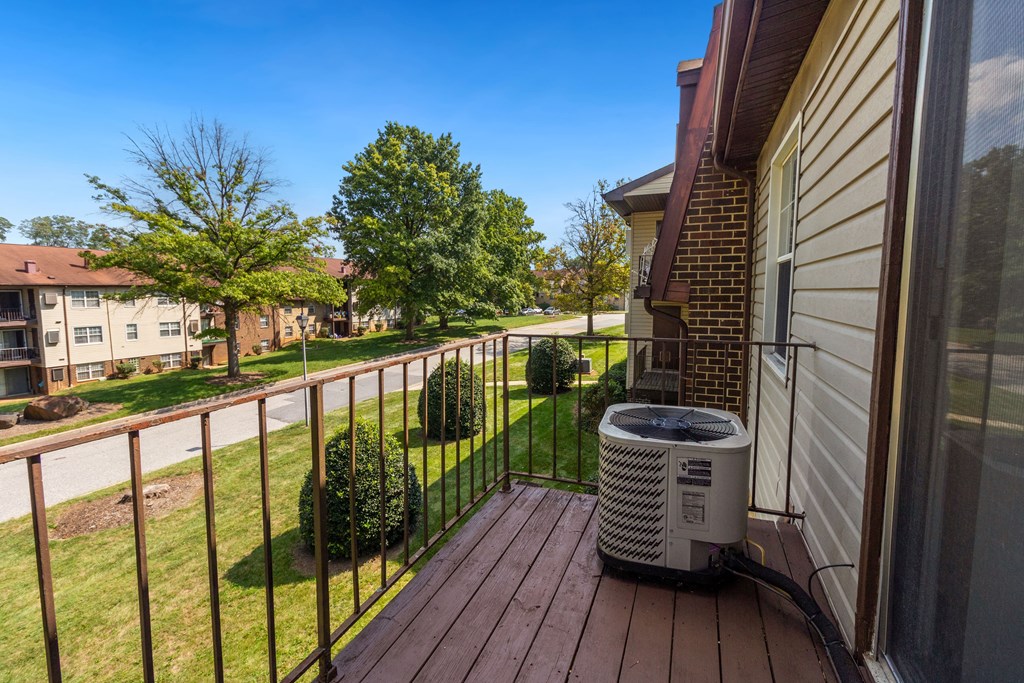 a heater sitting on the balcony of a house
