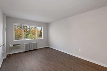 Living room with hardwood floor at South Pointe Apartments in Temple Hills, MD Living room with hardwood floor - Photo Gallery 3