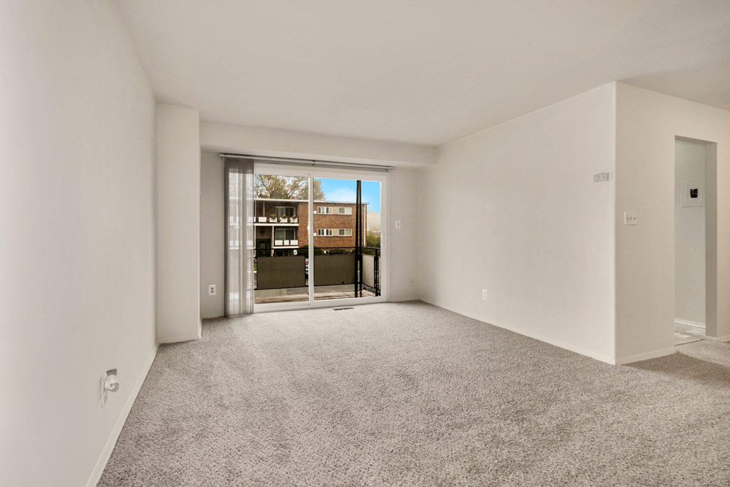 Empty, carpeted living room