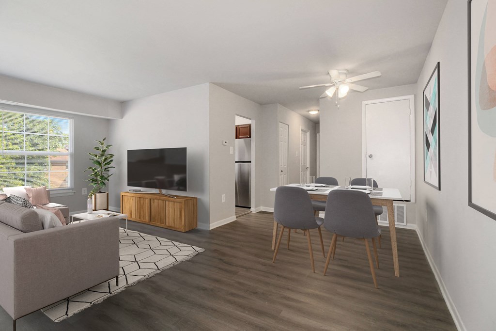 a living room and dining room with a table and chairs