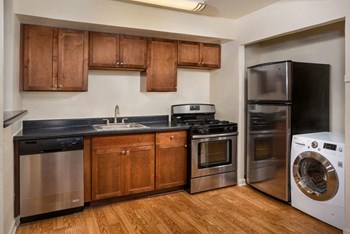 Kitchen with laundry machine at Park Greene Apartments Kitchen with laundry machine - Photo Gallery 4