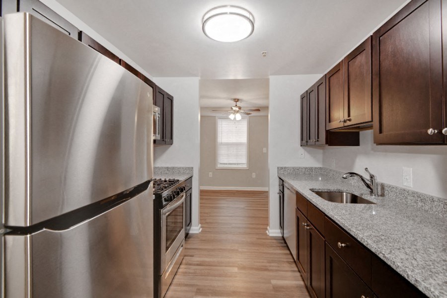 a kitchen with stainless steel appliances and granite counter tops