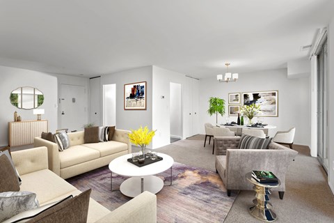 A living room with a white coffee table and a grey couch.