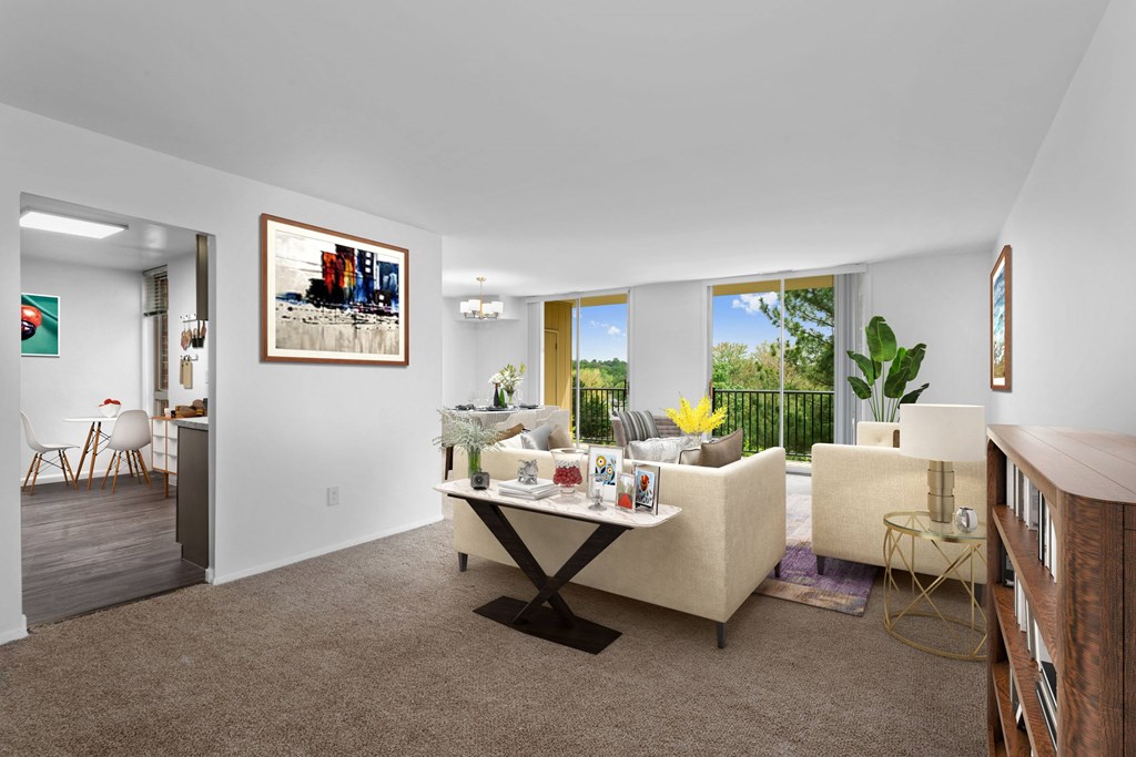 A living room with a white couch and a coffee table.