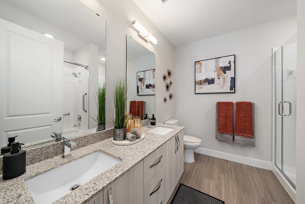 A bathroom with a double vanity  at Mira at Palmer Ranch, Florida, 34238