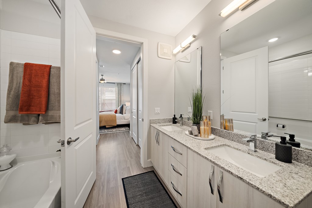 A bathroom double vanity sink and bath  at Mira at Palmer Ranch, Florida, 34238