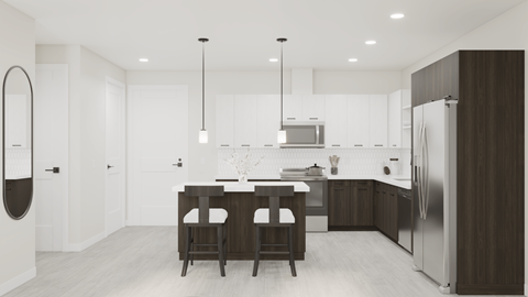 A modern kitchen with a dining table and chairs.