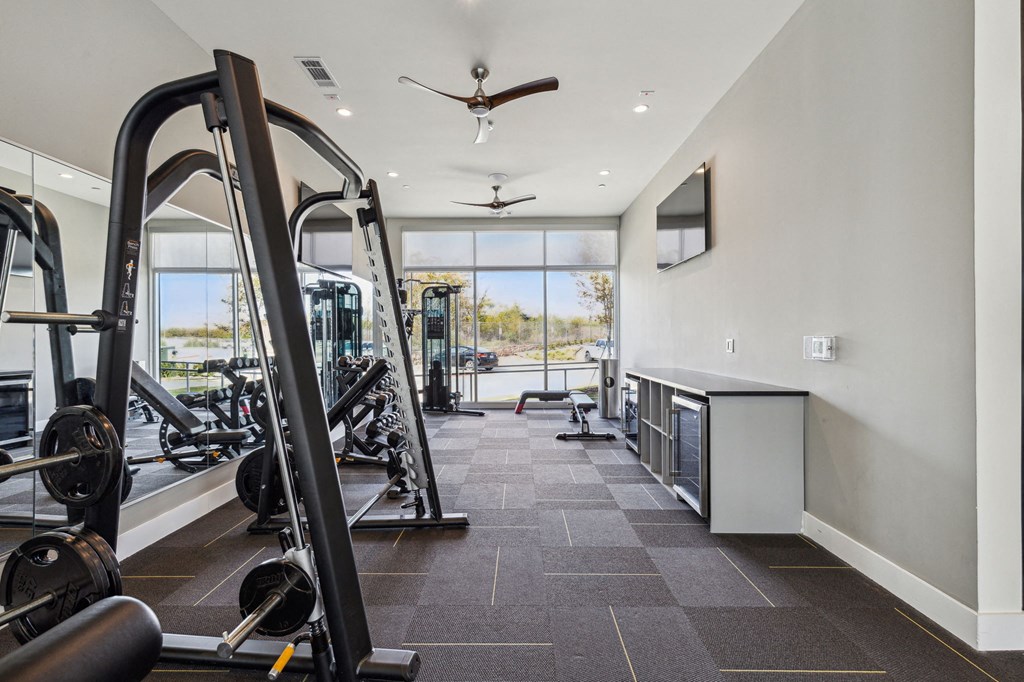 fitness center with exercise equipment at LynnCora, Grand Prairie, TX