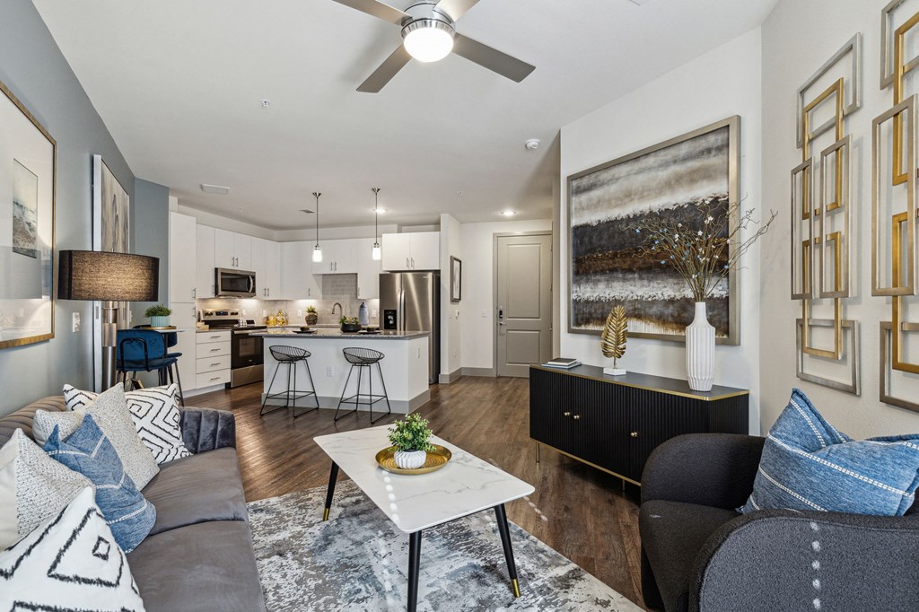 a living room with a couch and a table at LynnCora, Grand Prairie, 75052