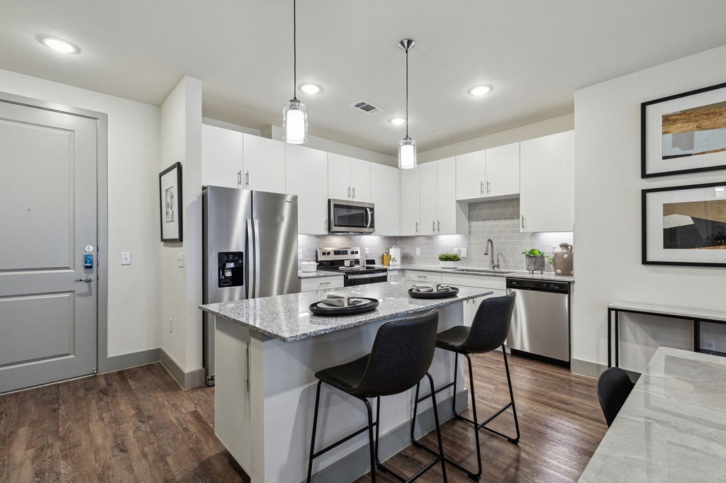 the residence apartment homes offers a spacious kitchen with stainless steel appliances at LynnCora, Texas, 75052