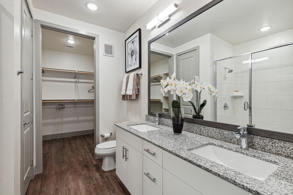 Model apartment with dual sinks in bathroom vanity at LynnCora, Grand Prairie, TX