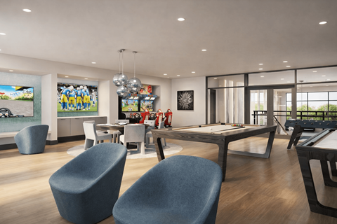 A modern living room with a pool table and a television.
