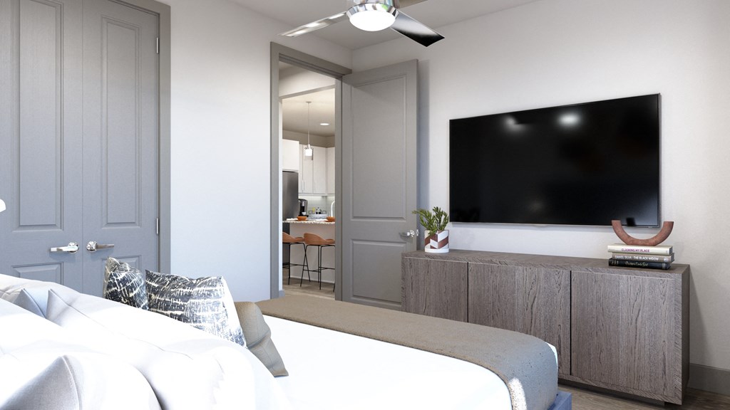 Model apartment bedroom area with ceiling fan at Ironcrest, North Richland Hills, 76180