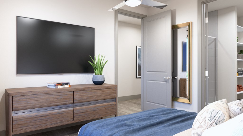 Model apartment bedroom area looking to hallway door at Ironcrest, North Richland Hills