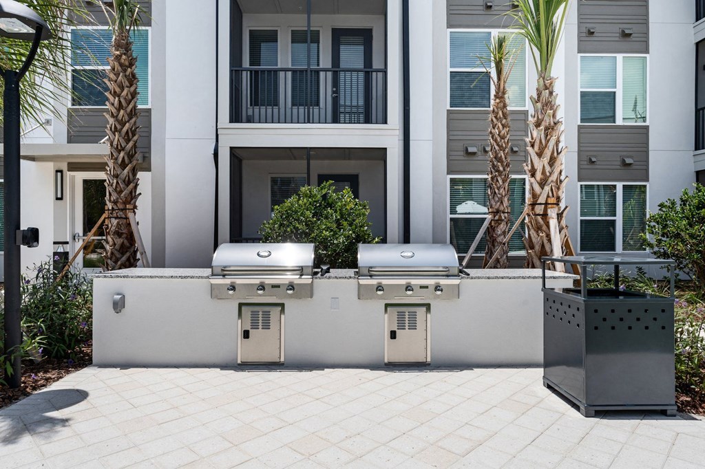 two outdoor grills in courtyard area at Mira at Palmer Ranch