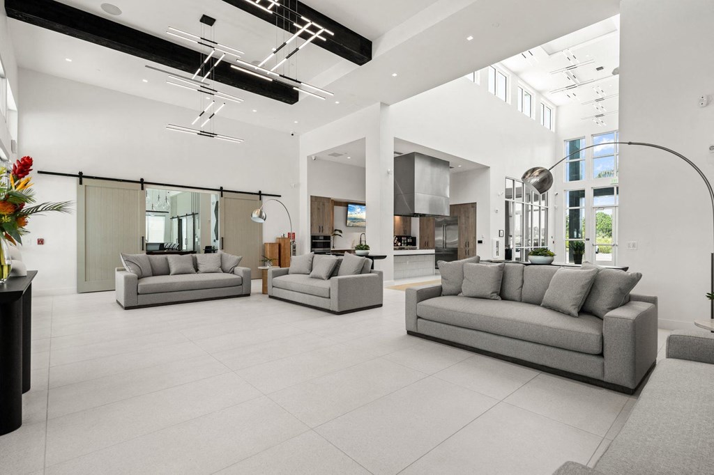 a large living room with couches
