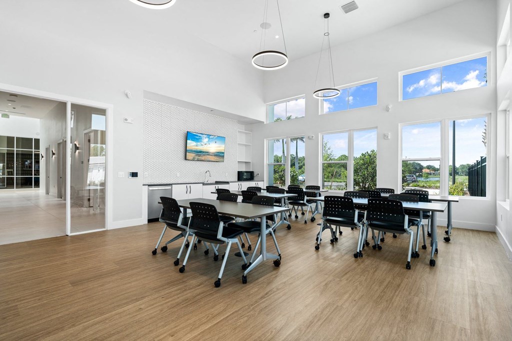 resident clubhouse with tables and chairs for seating