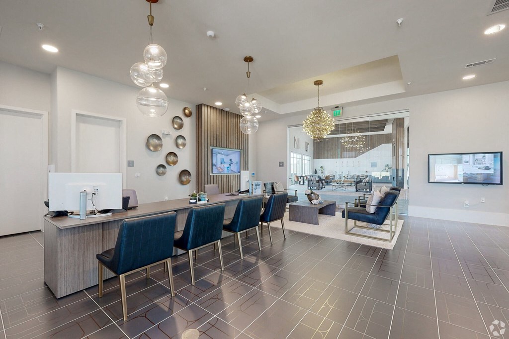 Ironcrest lobby with blue chairs and a reception desk