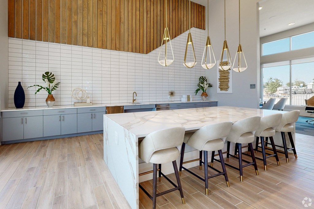 Ironcrest community kitchen with white tiles and a large island countertop
