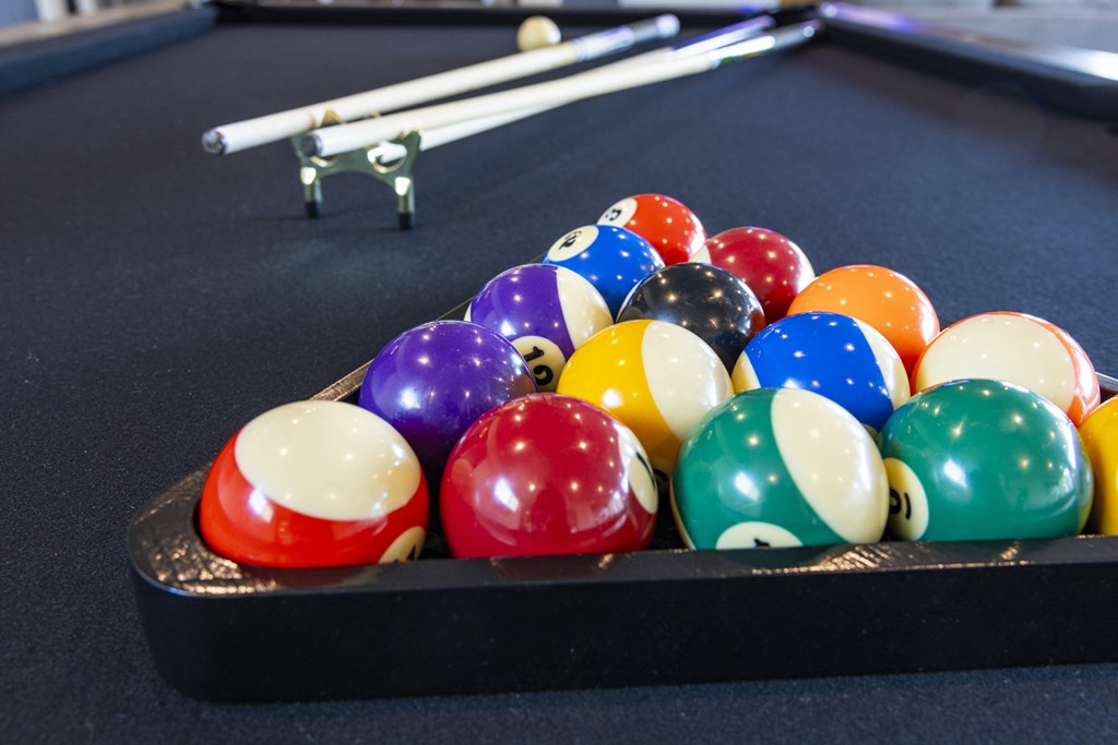 a game of billiards on a pool table