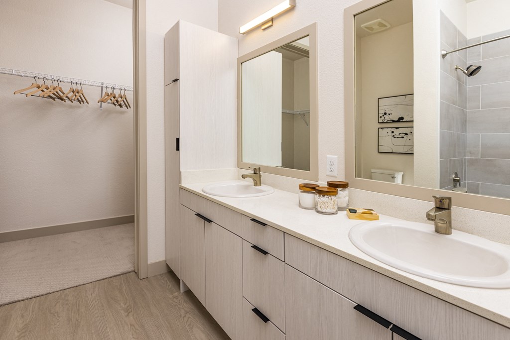 Double sink bath vanity and large walk in closet