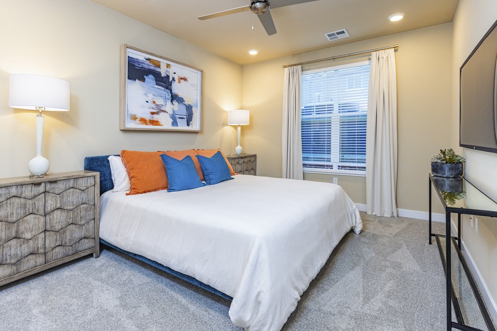 Anchor 532 apartment home bedroom with ceiling fan and large window