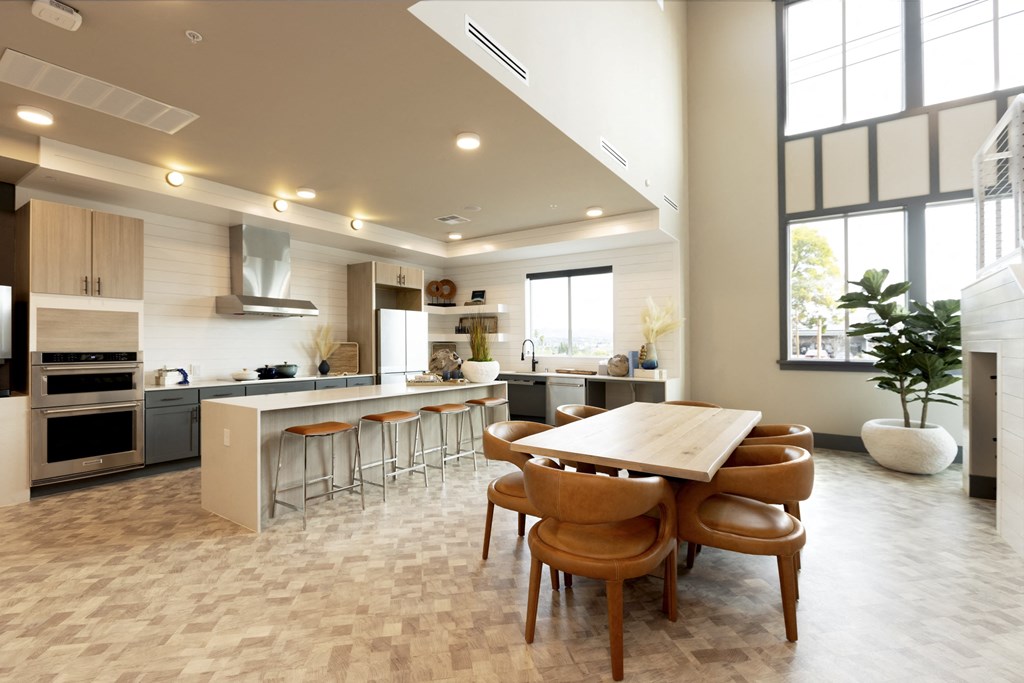 a kitchen and dining room with a wooden table and chairs