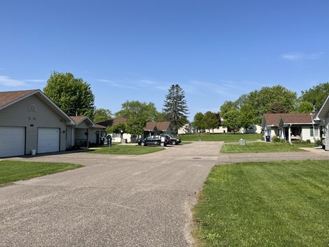 A residential area with houses and a clear blue sky.