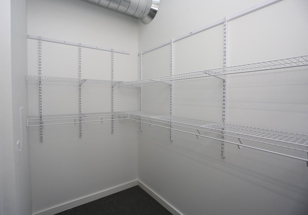 Empty shelves in a white room.