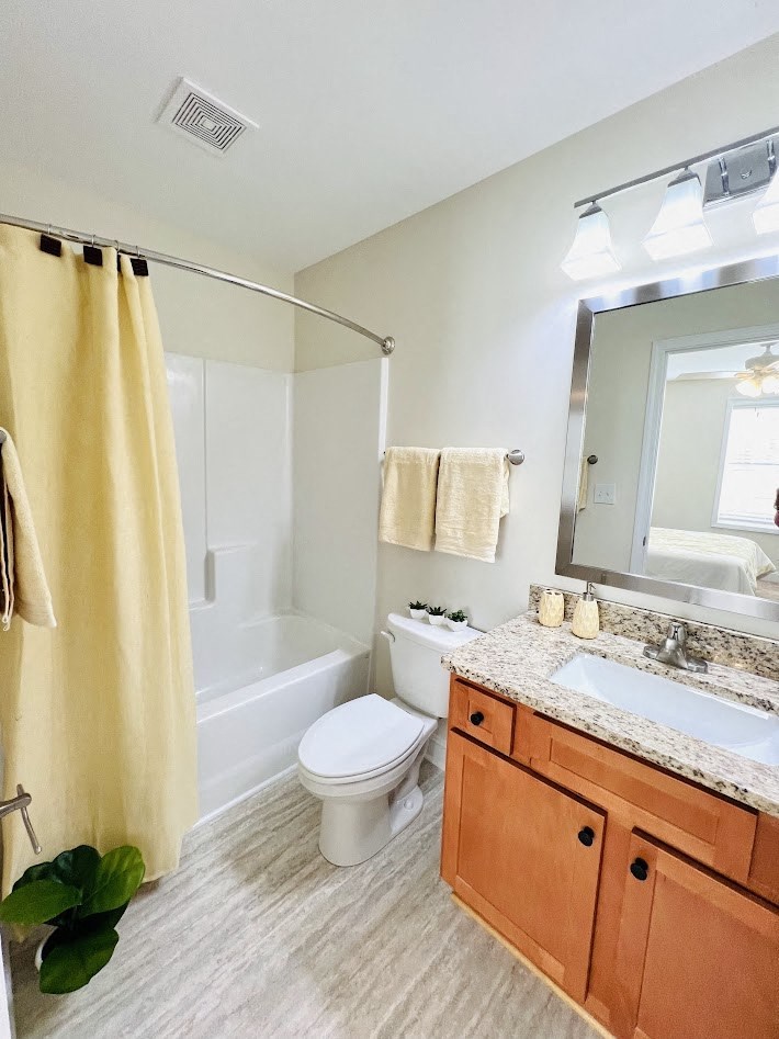 a bathroom with a sink toilet and a tub