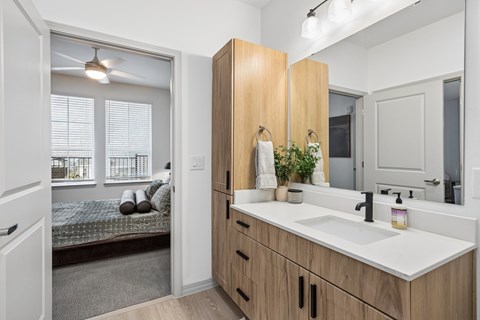 Contemporary apartment bathroom at The Elara in Farmers Branch, TX showcasing clean lines and stylish finishes near Dallas, TX