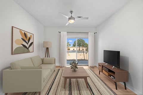 A living room with a couch, a coffee table, a television, and a painting on the wall.