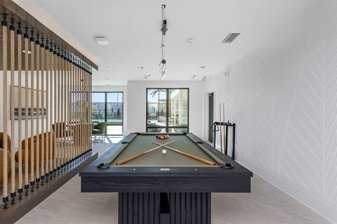 The game room with billiards at Revel in Clearwater, FL.