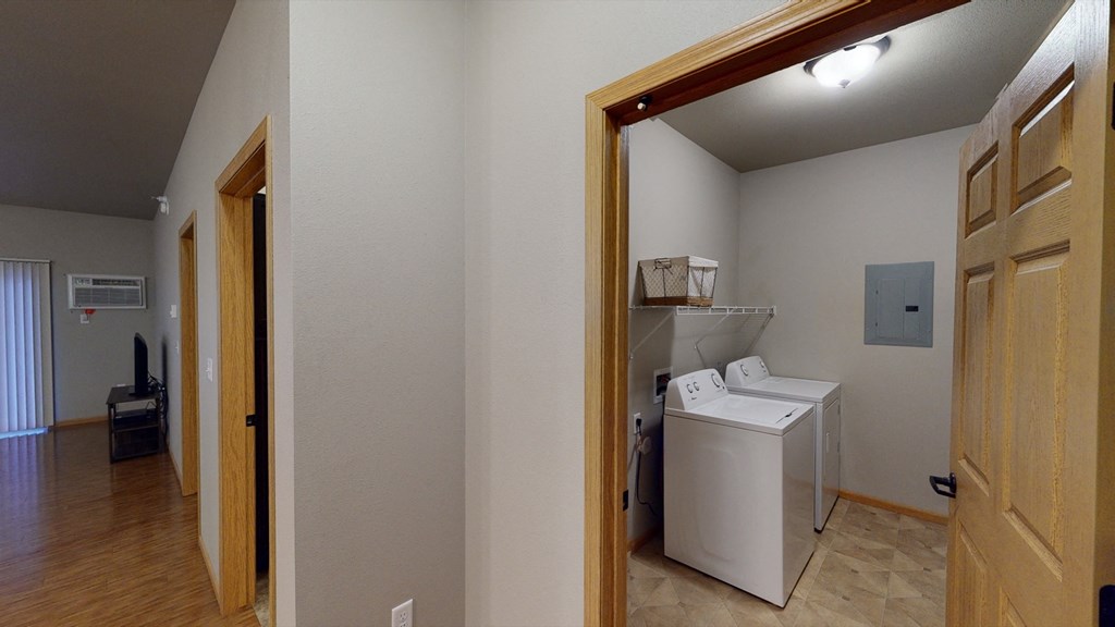 a laundry room with a washer and dryer in it