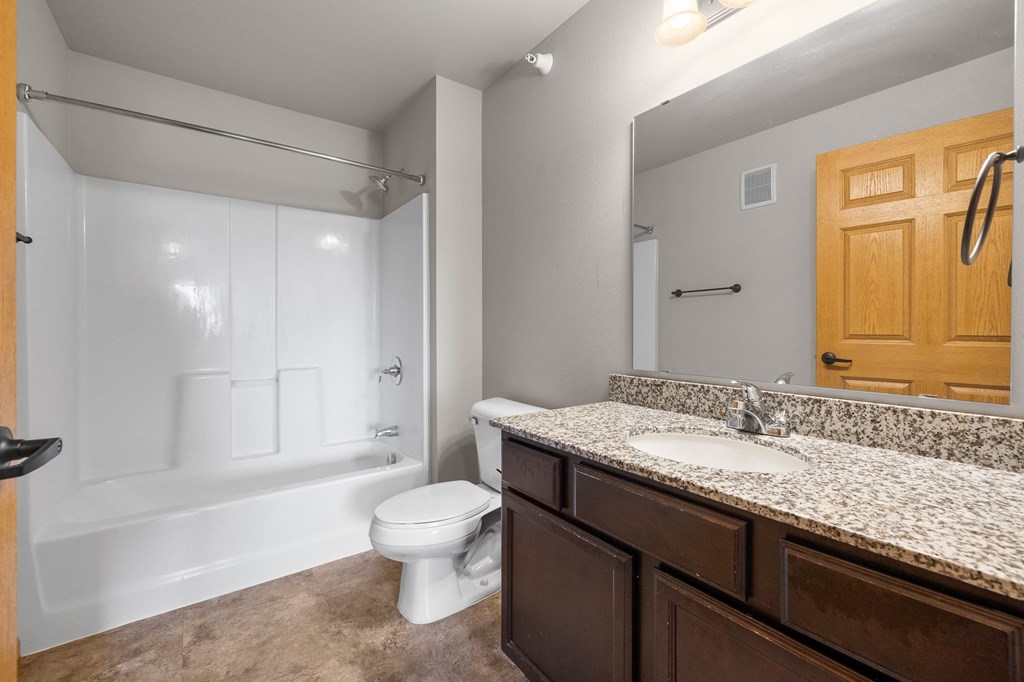 a bathroom with a toilet sink and bathtub
