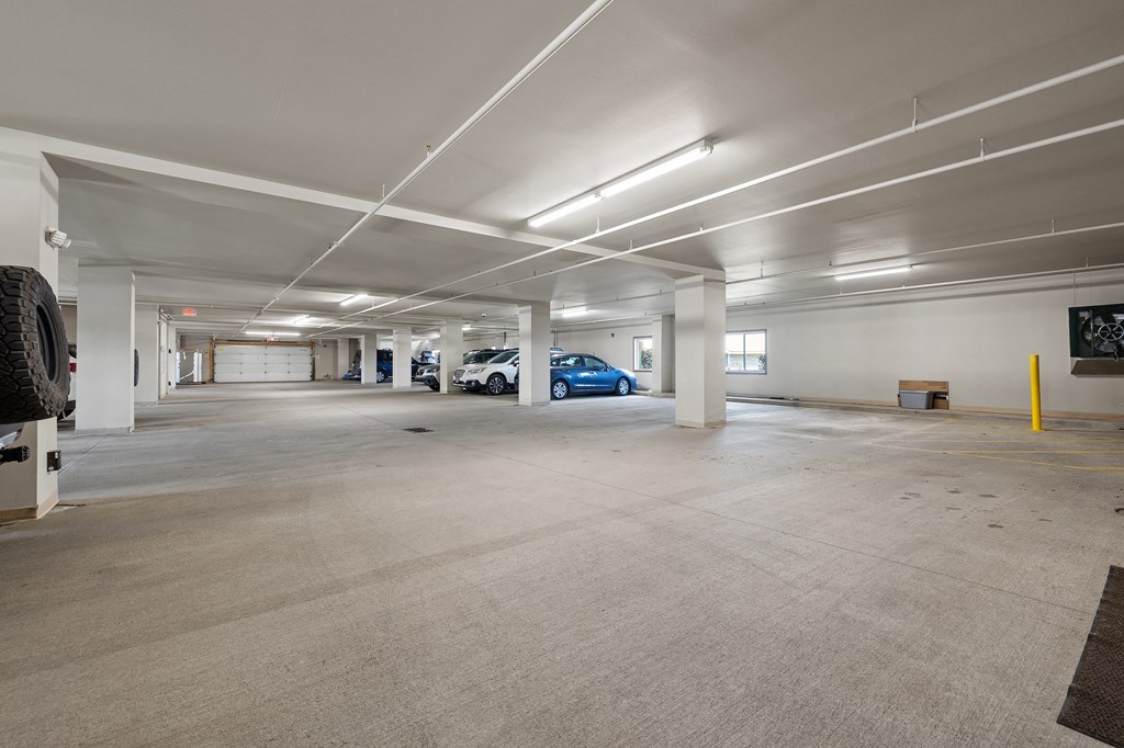 a parking garage with cars in it