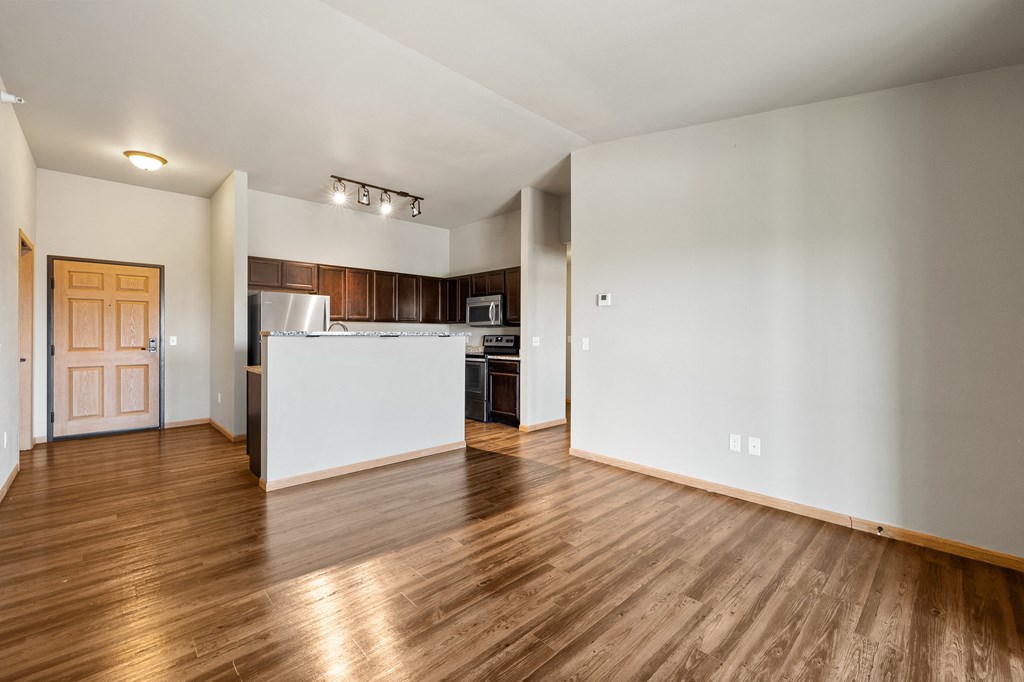 a kitchen and living room in a 555 waverly unit
