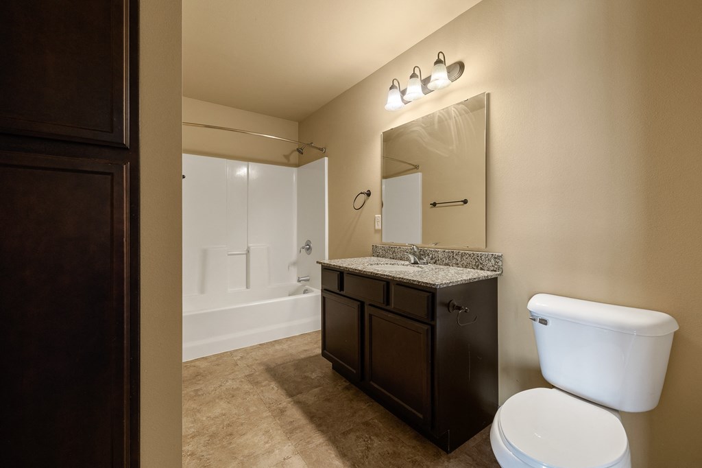 a bathroom with a toilet sink and bathtub