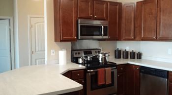 a kitchen with a stove and a microwave