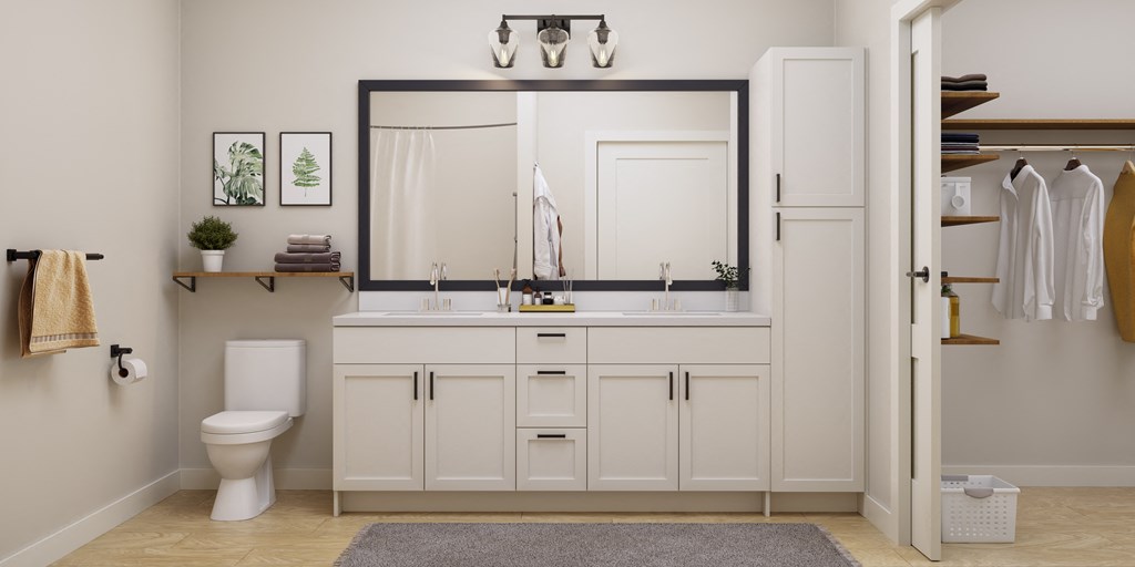 a white bathroom with a large mirror and a toilet