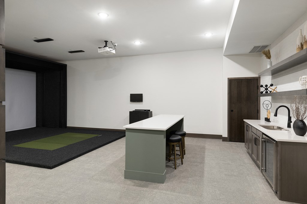 a kitchen and living room with a counter top in a house