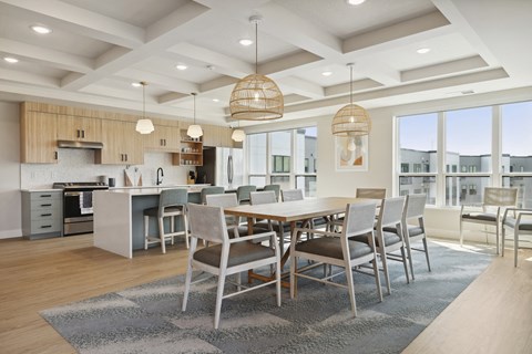 A modern dining room with a large table and chairs.