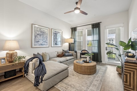 Spacious Living Area with Wood Style Flooring at Marisol Apartments in Port Charlotte FL