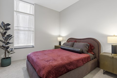 Contemporary bedroom at Harlow Apartments in Chanhassen, MN designed for comfort and relaxation