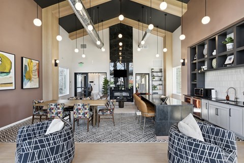 A modern living room with a patterned sofa and a wooden dining table.