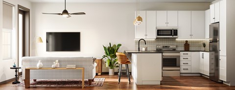 A modern kitchen with white cabinets and a black countertop.