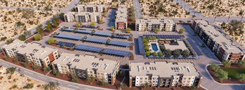 A large building complex with solar panels on the roofs.