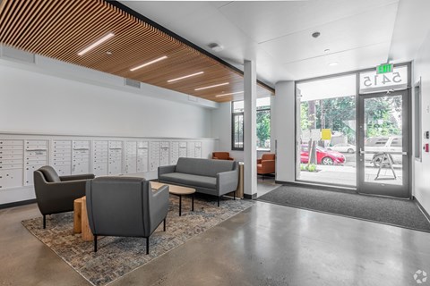 A waiting area with a couch, chairs, and a coffee table.